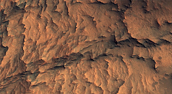 Exposure of Layered Bedrock Northwest of Hellas Planitia