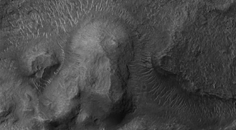 Topographic Transition from Chaotic Terrain to Outflow Channel Terrain