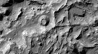 Eroded Layered Deposits on Floor of Large Crater
