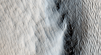 Dust Covered Channels on Tharsis Tholus