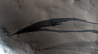Slope Streaks on a Dusty Planet