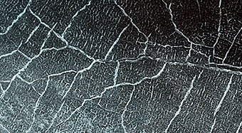 Cracks in a Crater’s Ice