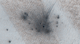 A New Crater on a Dusty Slope