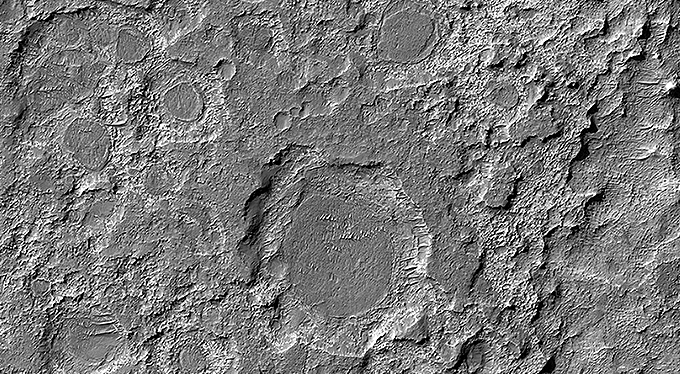 Dark Patches Formed by Craters