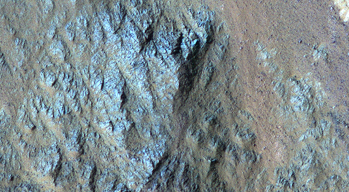 Varied Types of Rock in a Crater in Eos Chasma